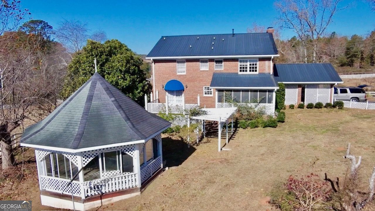 740 Patrick Ml Road Southwest Winder, GA 30680 - Photo 11 of 12 front view of a house with a yard