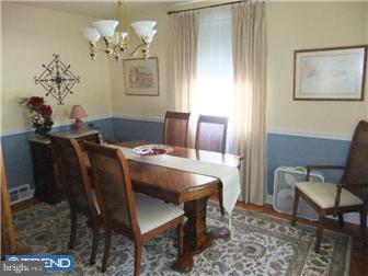 361 Garden Road Springfield, PA 19064 - Photo 2 of 12 a dining room with furniture and chandelier