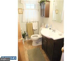 361 Garden Road Springfield, PA 19064 - Photo 8 of 12 a bathroom with a sink and a mirror