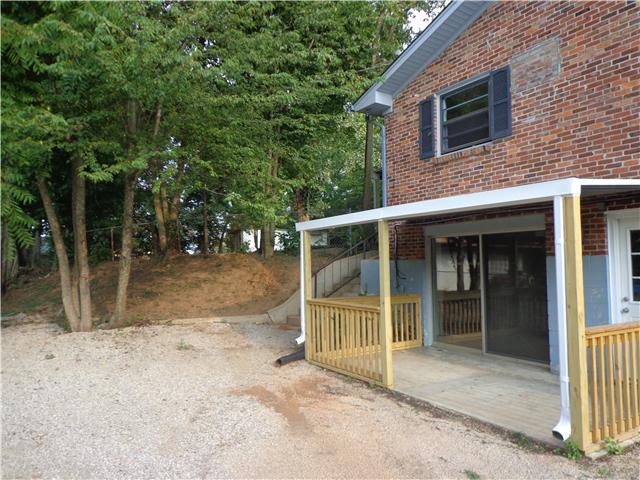 318 Jackson Road Portland, TN 37148 - Photo 17 of 18 Side Covered Porch, which enters into Rec Room