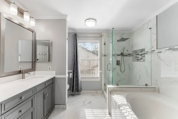 a bathroom with a sink double vanity and a mirror