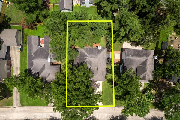 an aerial view of house with swimming pool outdoor seating and yard