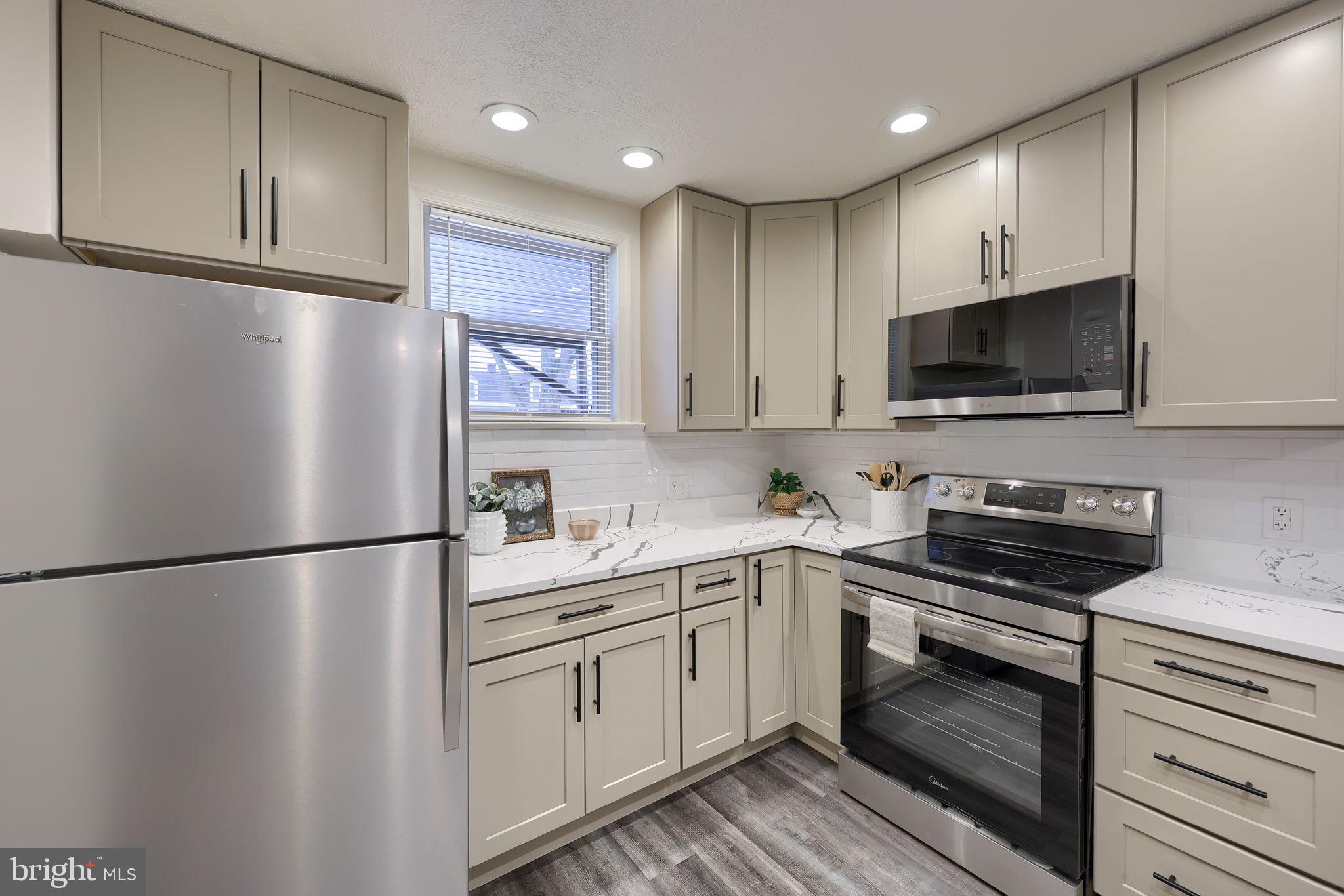 528 High Street Lancaster, PA 17603 - Photo 11 of 32 a kitchen with a refrigerator stove and microwave