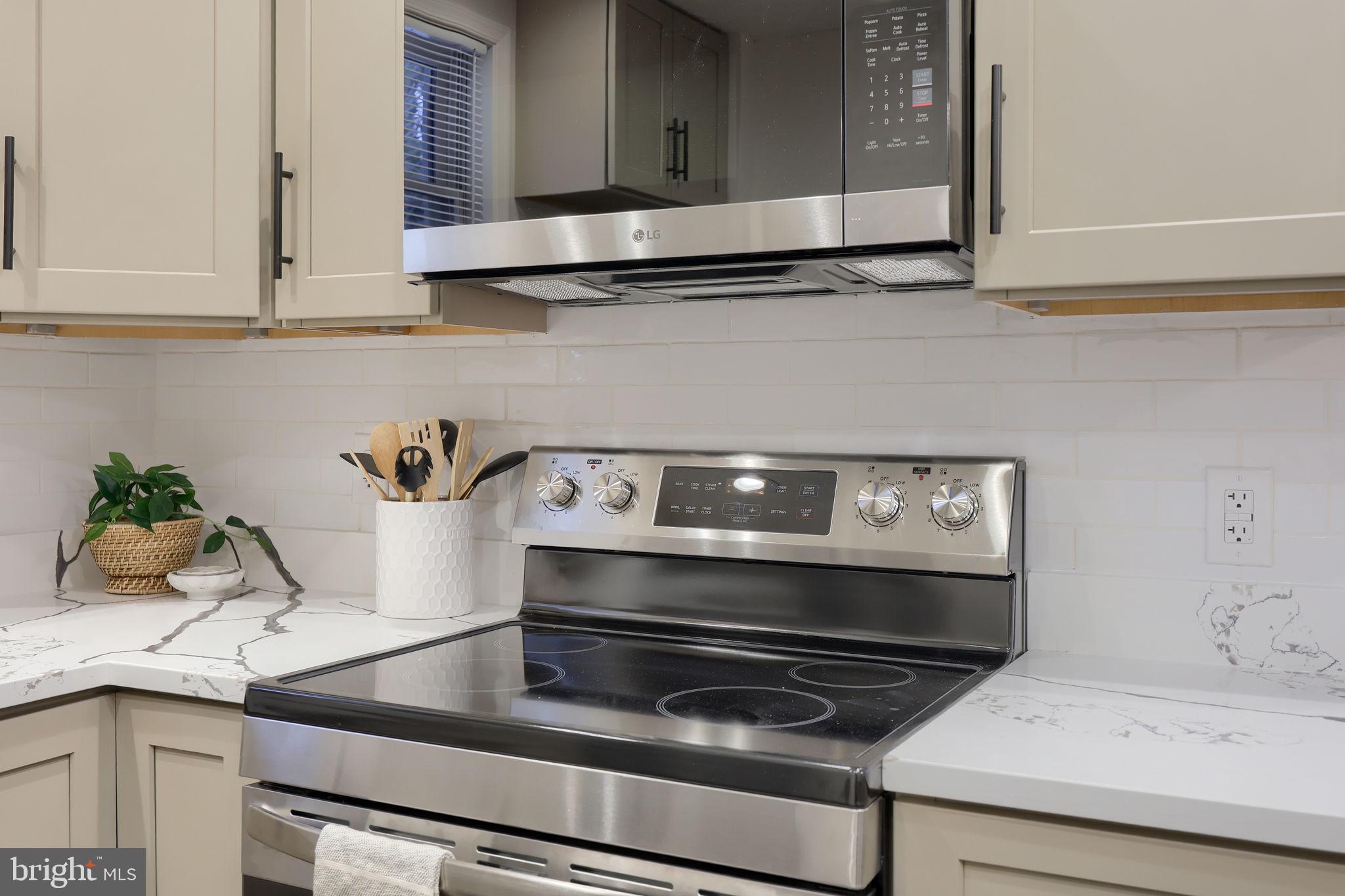 528 High Street Lancaster, PA 17603 - Photo 13 of 32 a stove top oven sitting inside of a kitchen