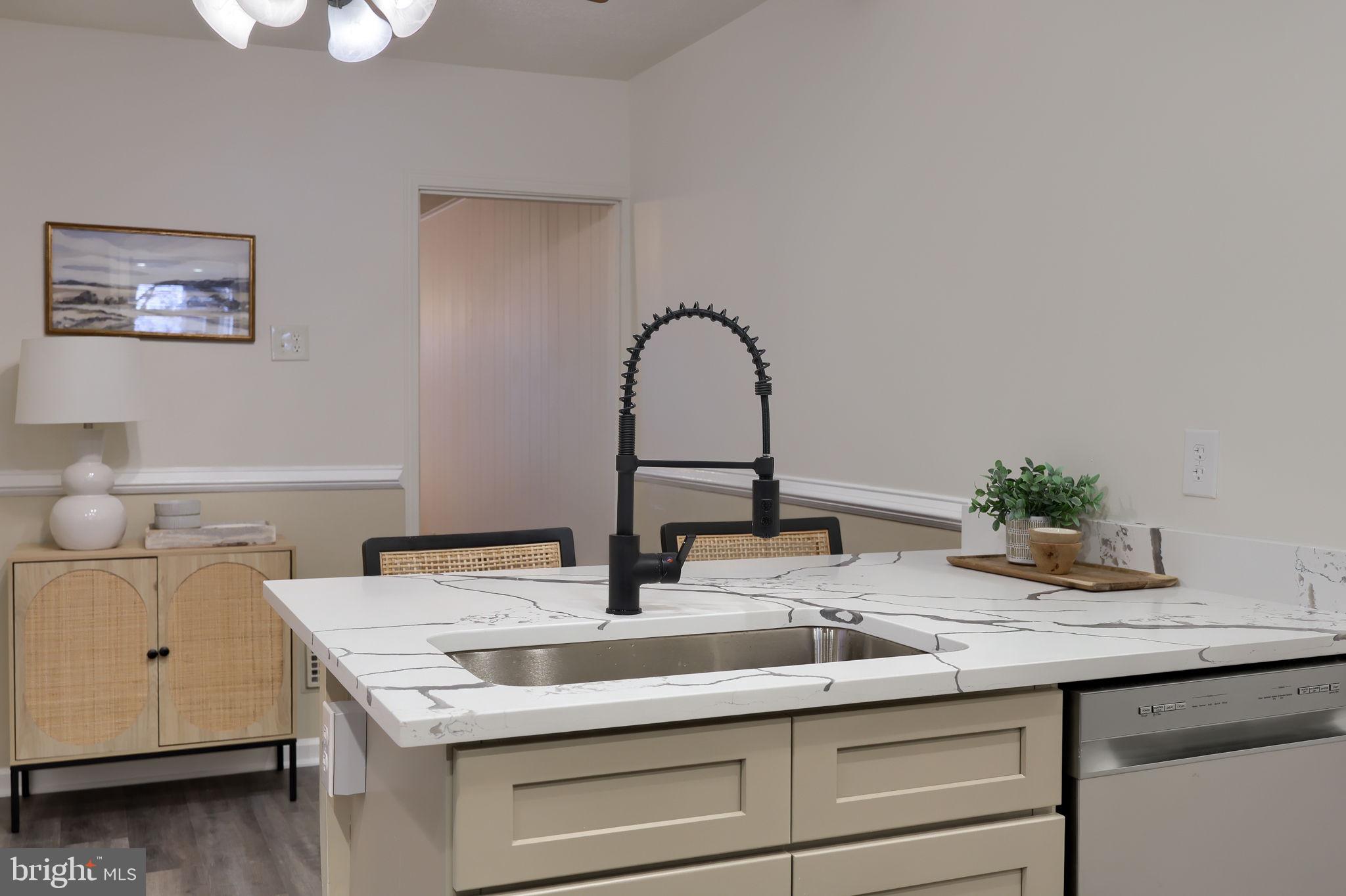 528 High Street Lancaster, PA 17603 - Photo 16 of 32 a kitchen with a sink and a stove with wooden floor