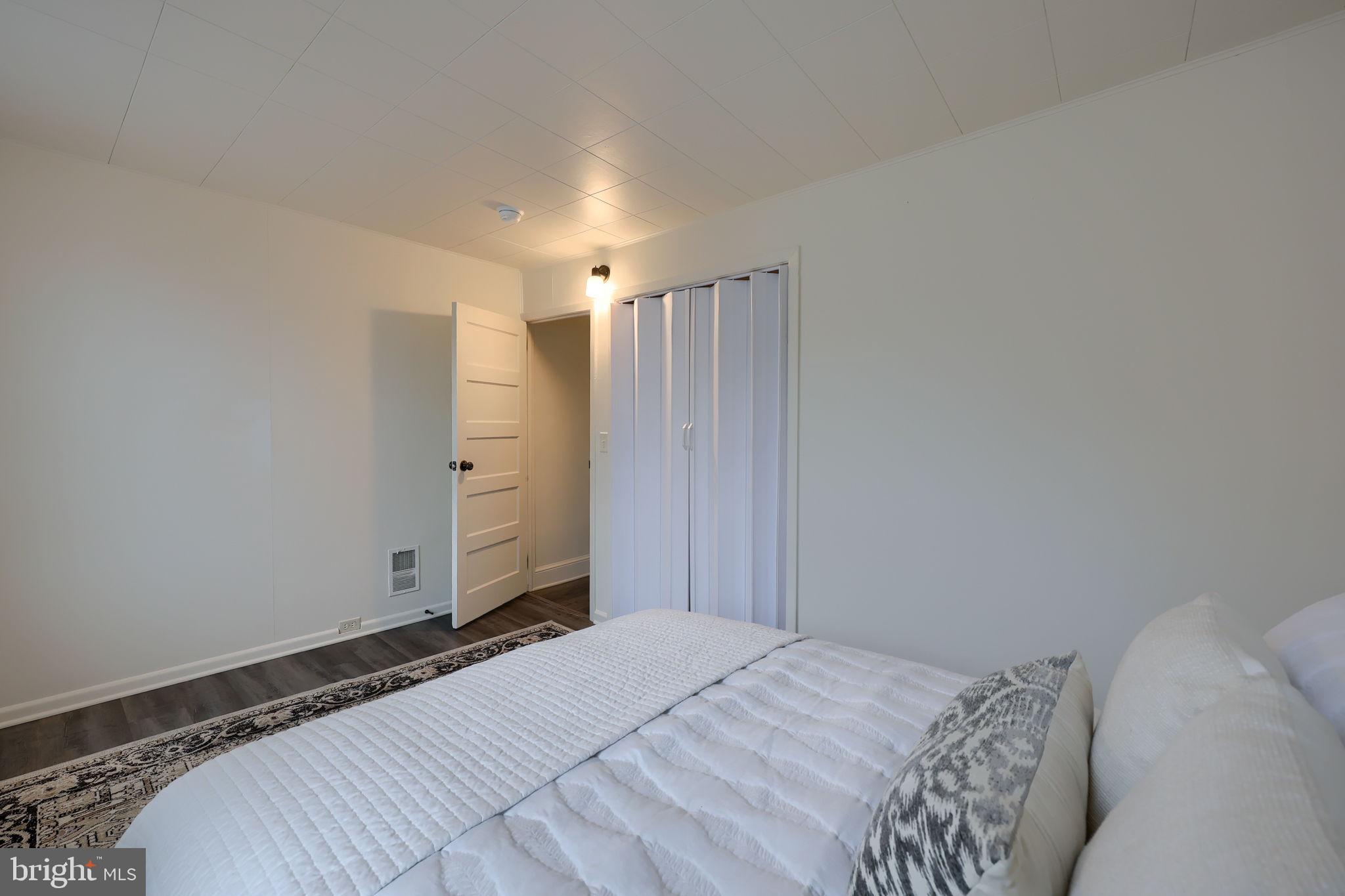 528 High Street Lancaster, PA 17603 - Photo 18 of 32 a bedroom with a bed and utility room