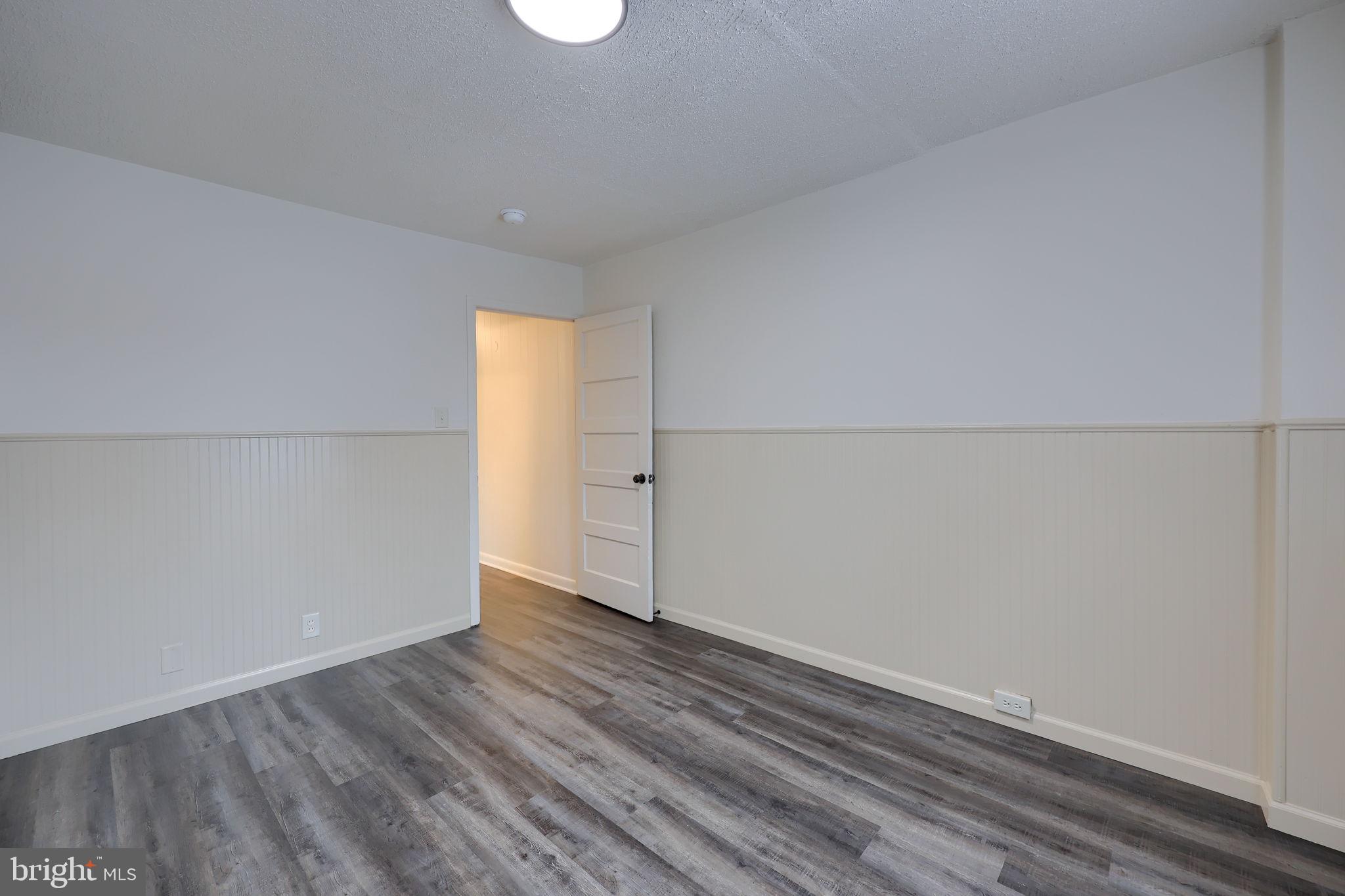 528 High Street Lancaster, PA 17603 - Photo 20 of 32 an empty room with wooden floor and white walls