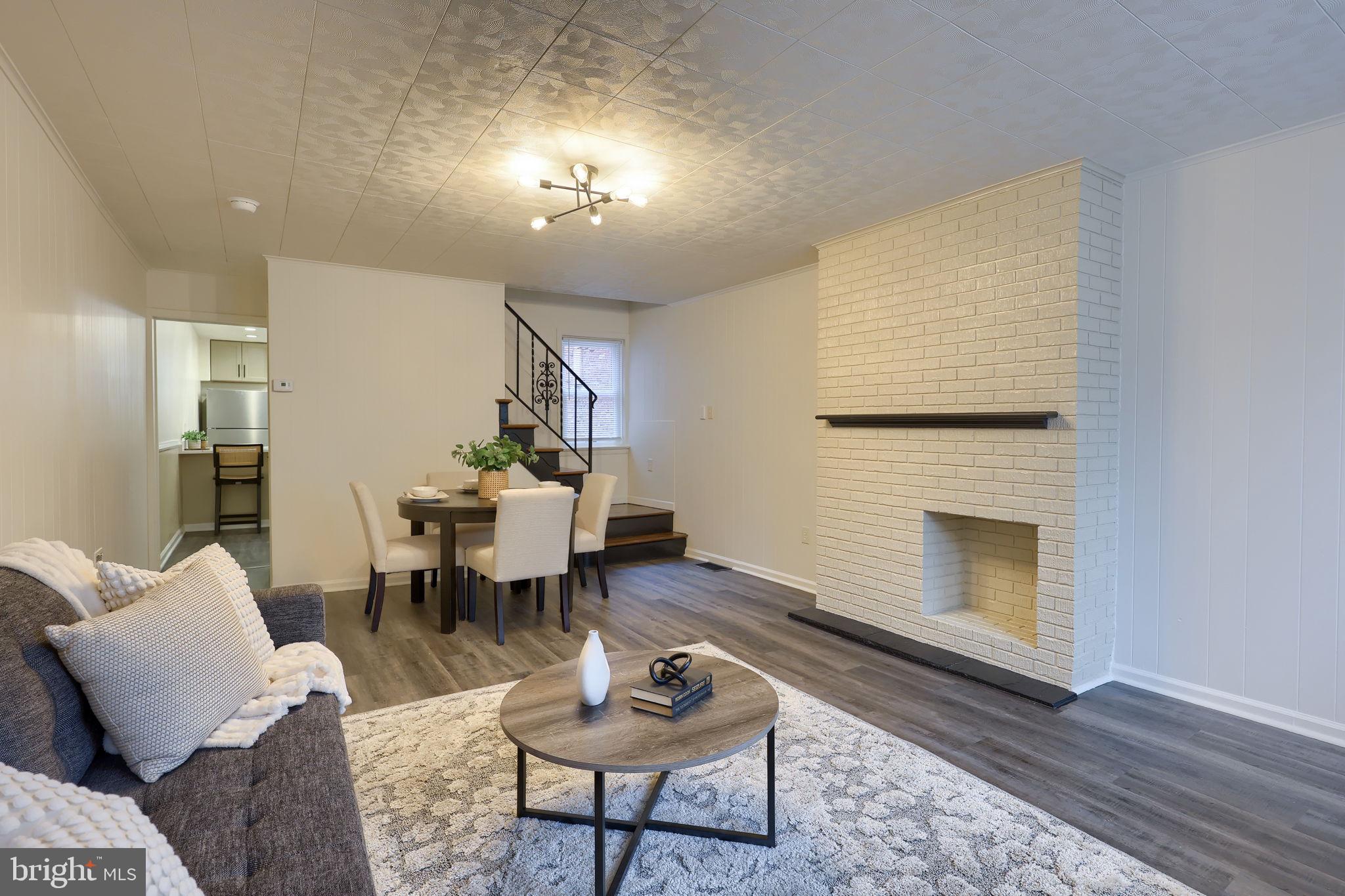 528 High Street Lancaster, PA 17603 - Photo 2 of 32 a living room with furniture and a fireplace