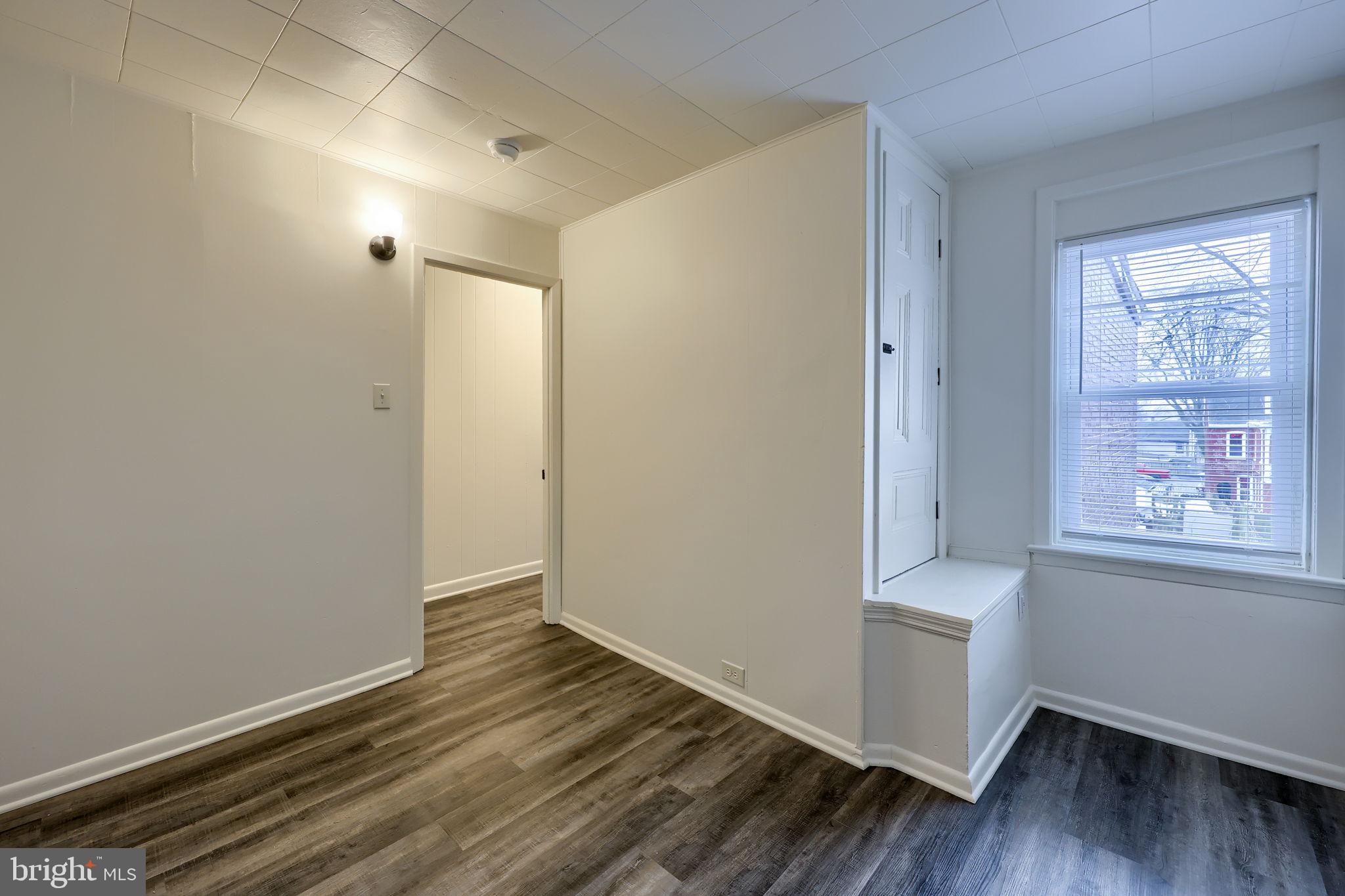 528 High Street Lancaster, PA 17603 - Photo 24 of 32 an empty room with wooden floor and windows