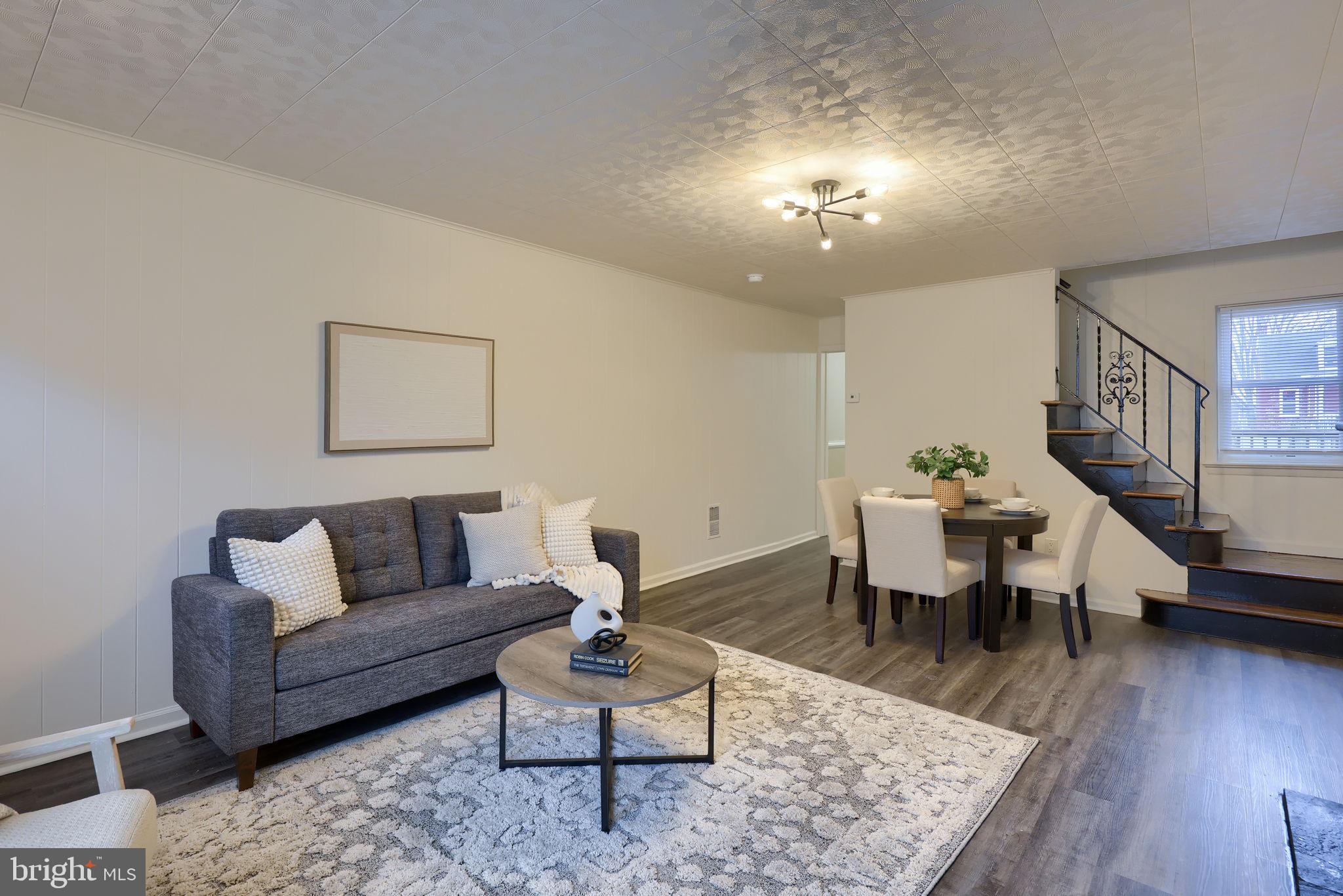 528 High Street Lancaster, PA 17603 - Photo 3 of 32 a living room with furniture and wooden floor