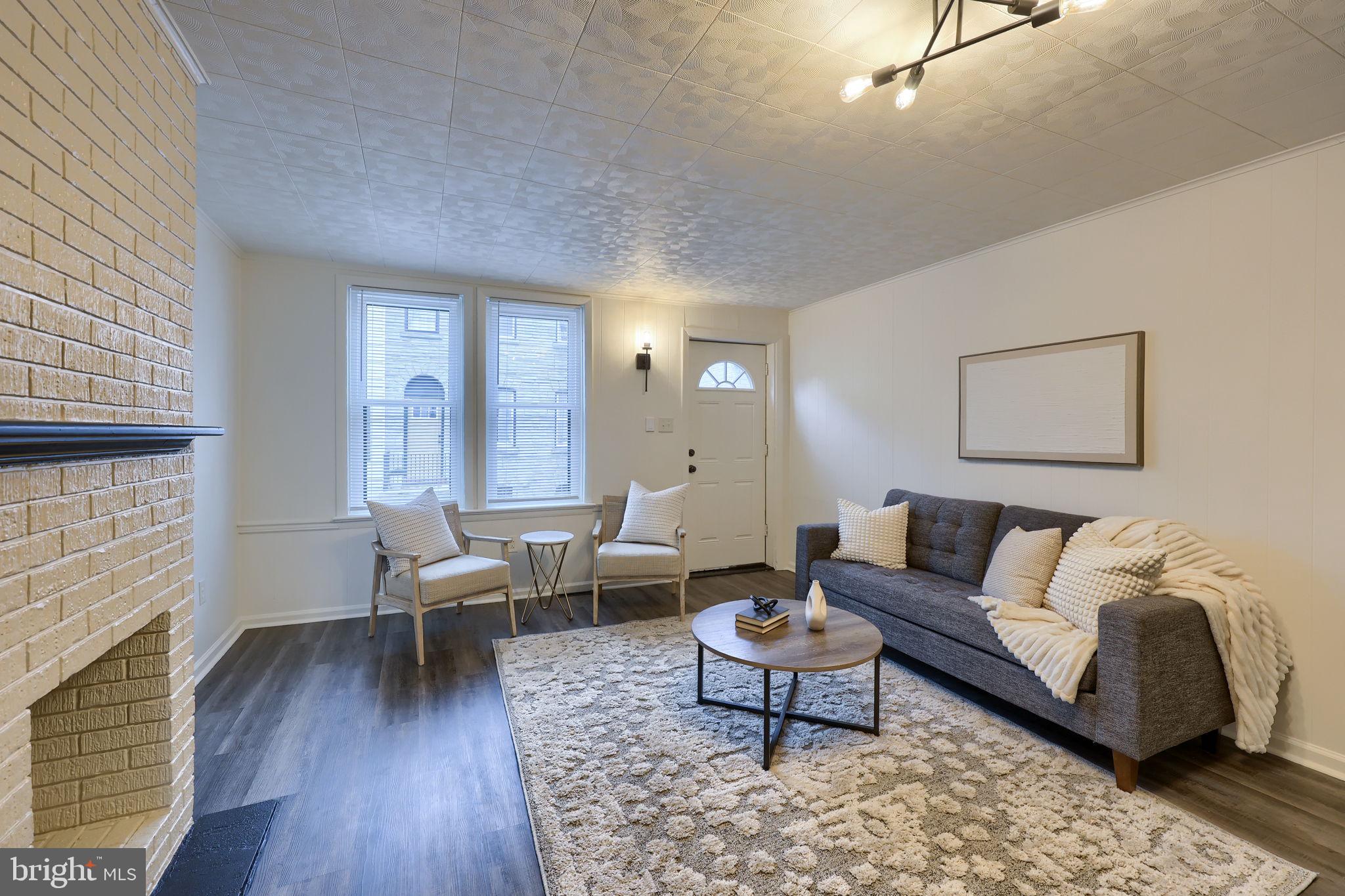 528 High Street Lancaster, PA 17603 - Photo 4 of 32 a living room with furniture wooden floor and a fireplace