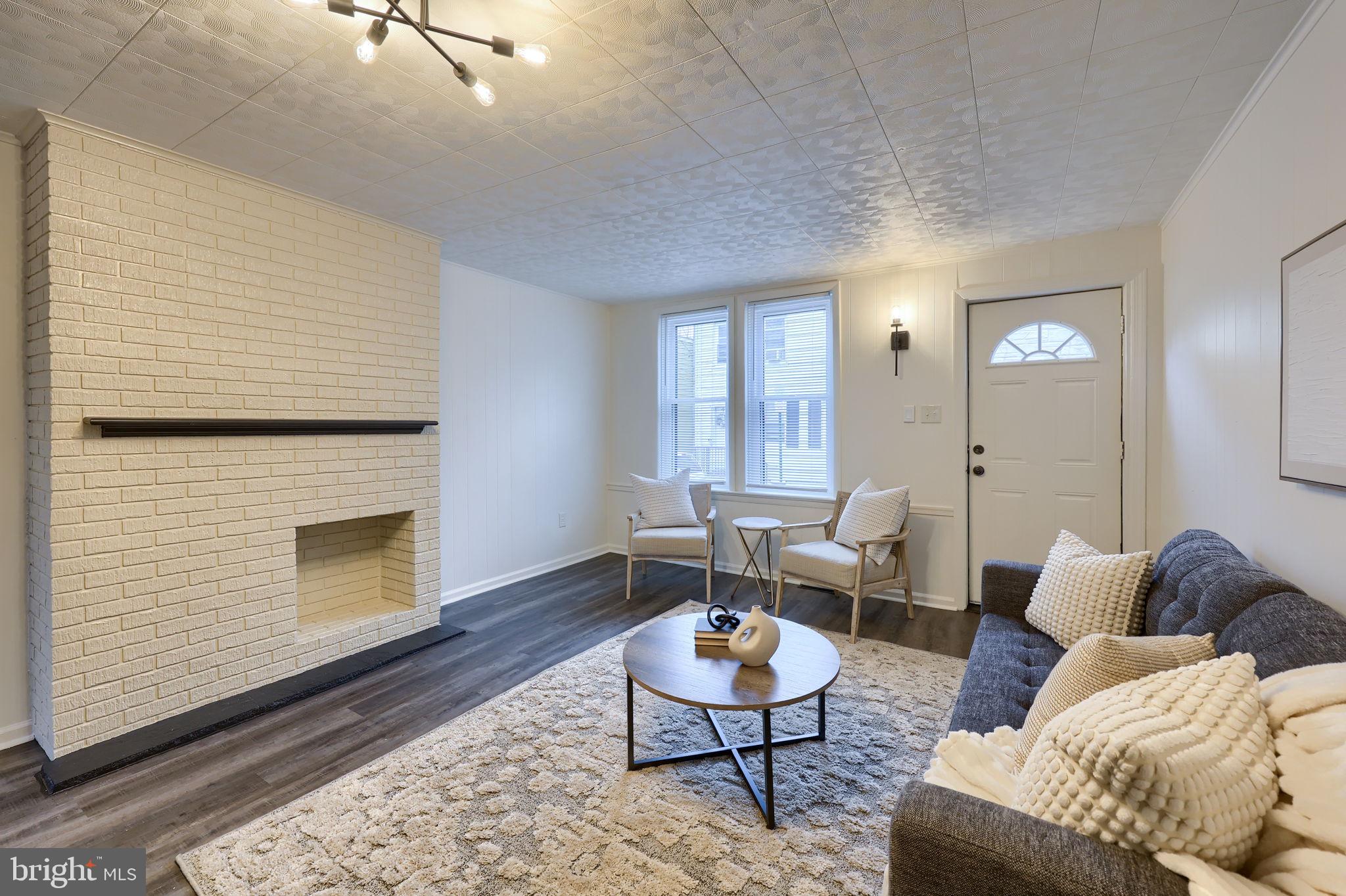 528 High Street Lancaster, PA 17603 - Photo 5 of 32 a living room with furniture and a fireplace