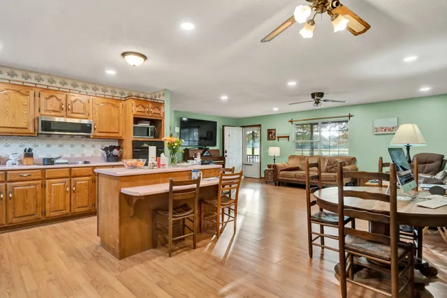 a kitchen with lots of counter top space and furniture