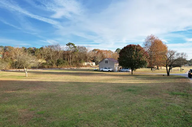 a view of a fountain in front of a house