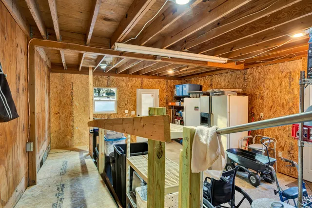 a view of a house with a yard and sitting area