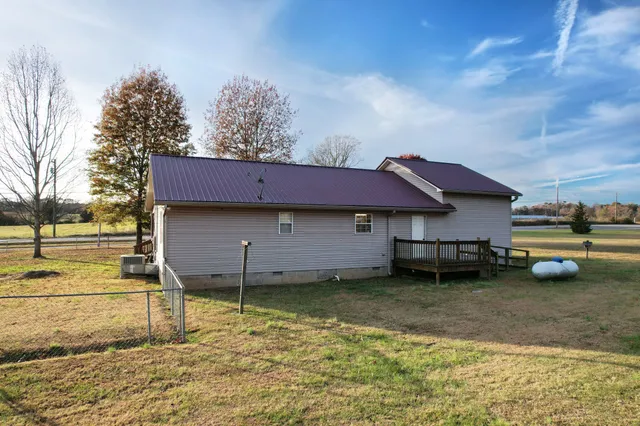 a view of a balcony with wooden fence