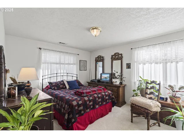 a bathroom with a toilet a sink and a mirror