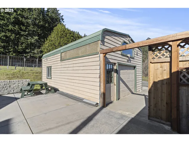 a view of a big yard with an buildings in the background