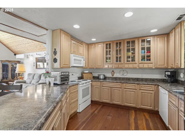 a kitchen with lots of counter top space and a sink