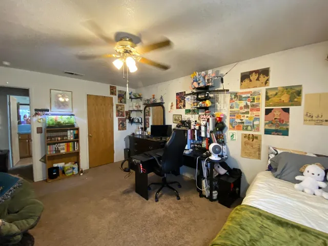 a bathroom with a sink a toilet a mirror and shower