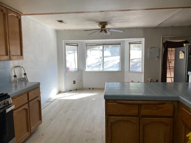 a living room with furniture a rug and a window