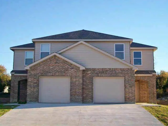 a front view of a house with yard