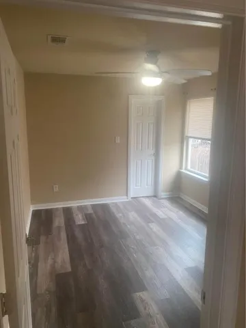 a view of an empty room and window