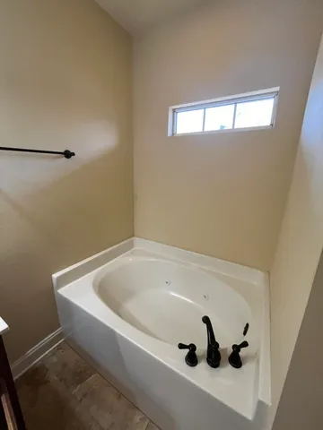 a view of a backyard with wooden fence