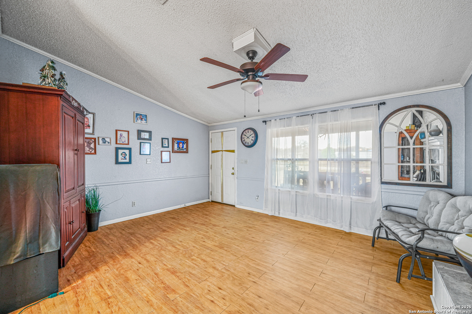 927 County Road 6846 Lytle, TX 78052 - Photo 12 of 21 a bedroom with a bed dresser and a window