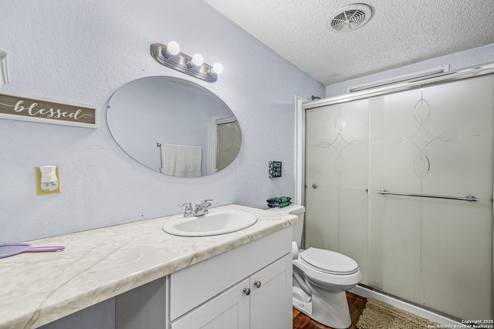 927 County Road 6846 Lytle, TX 78052 - Photo 14 of 21 a bathroom with a sink a toilet and shower