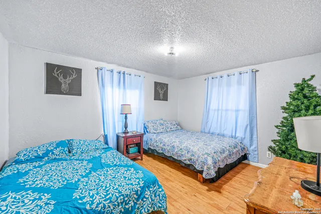 a bedroom with double bed and a window