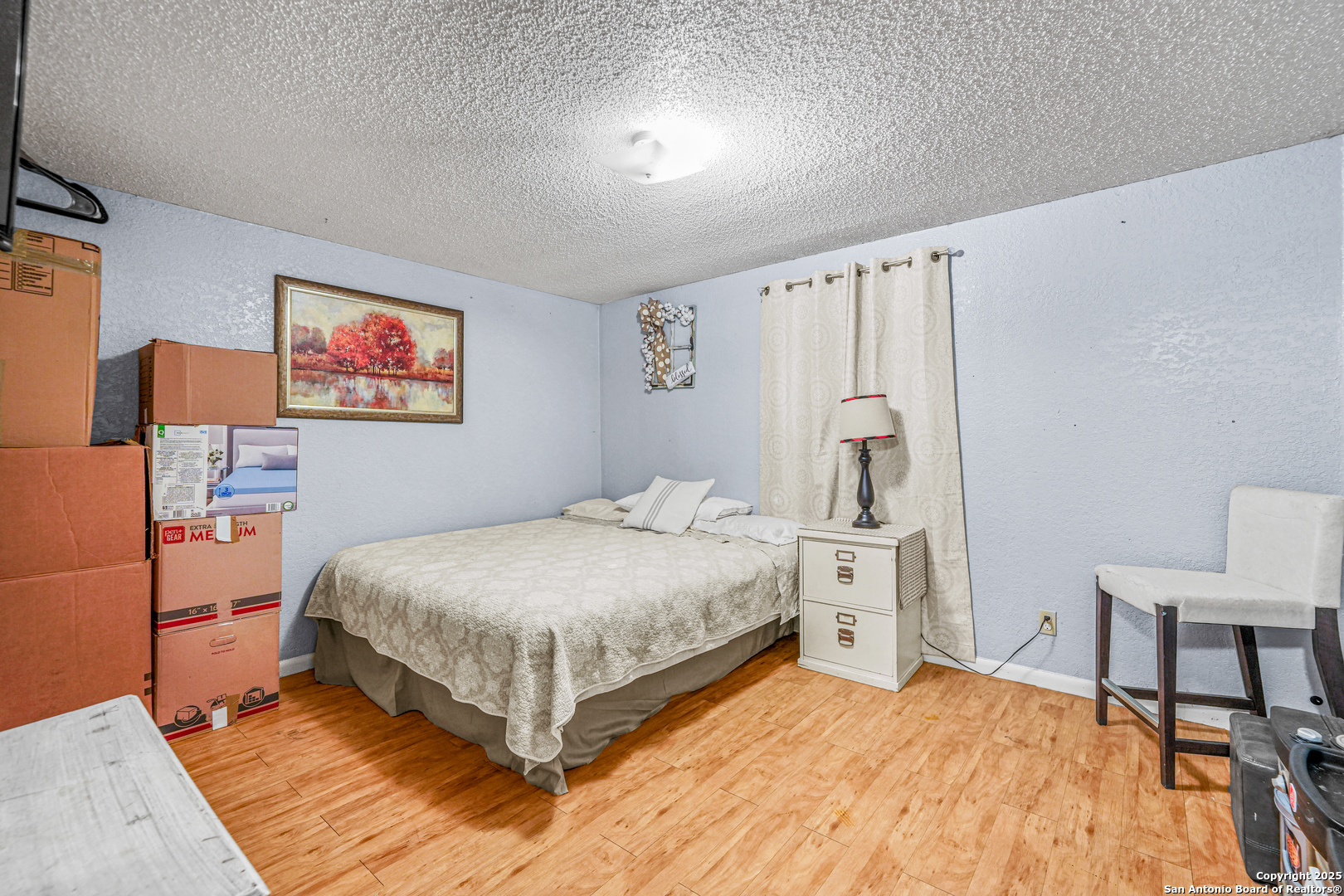 927 County Road 6846 Lytle, TX 78052 - Photo 16 of 21 a bedroom with a bed and a table in it