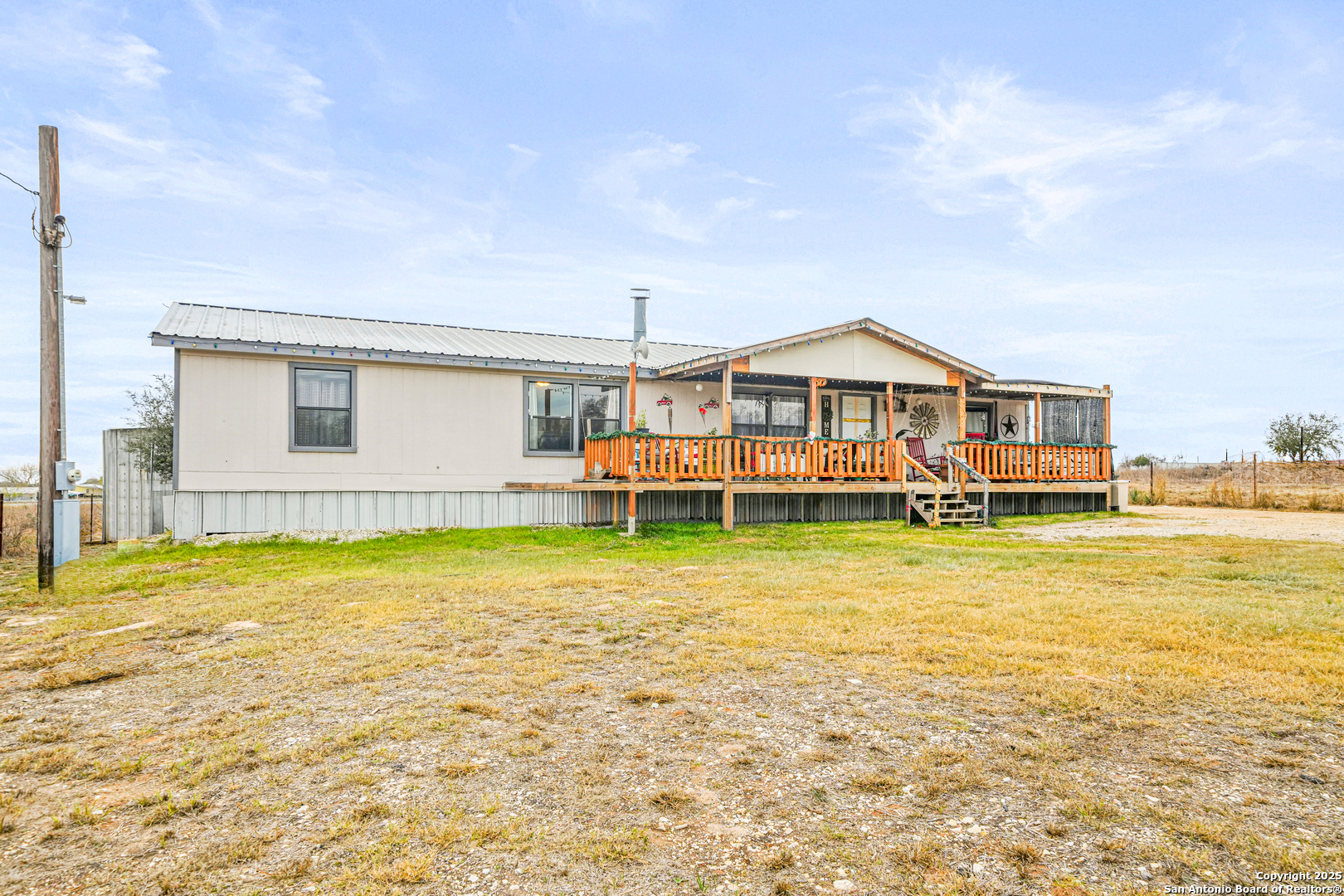 927 County Road 6846 Lytle, TX 78052 - Photo 20 of 21 a front view of a house with swimming pool having outdoor seating