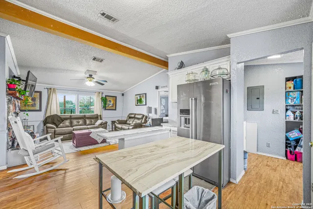a very nice looking dining room with a table and chairs