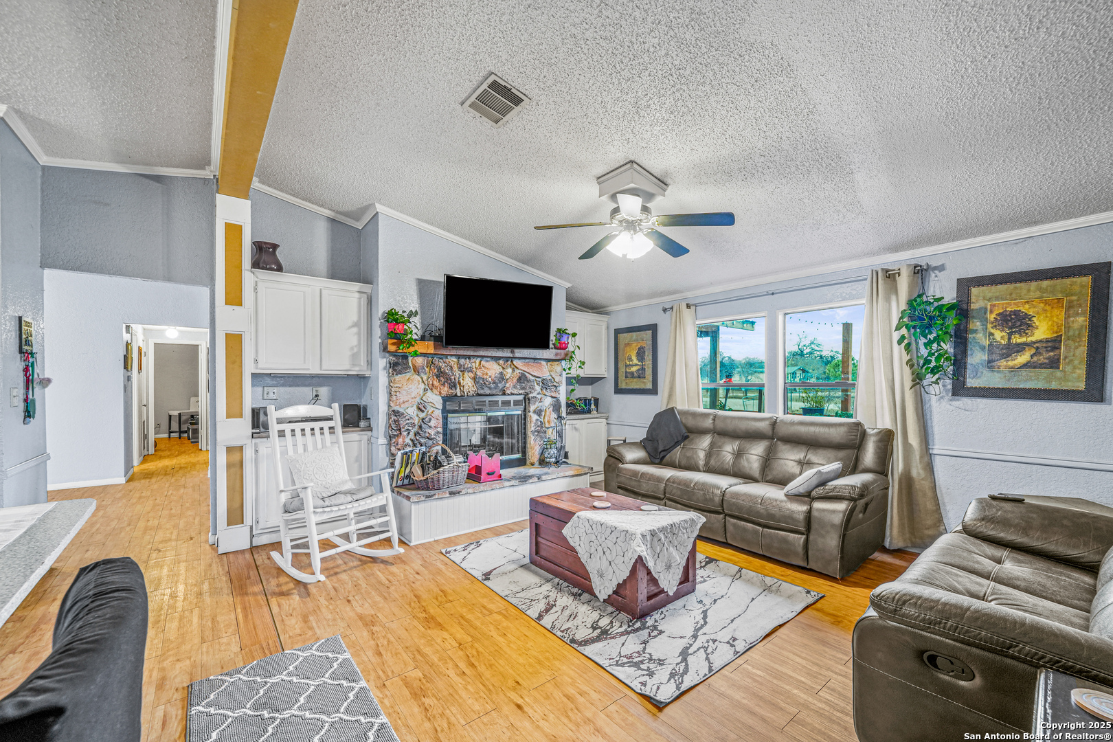 927 County Road 6846 Lytle, TX 78052 - Photo 6 of 21 a living room with furniture and a flat screen tv