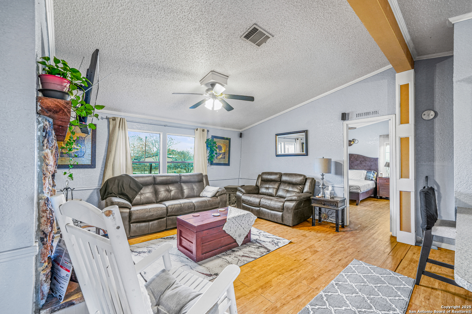 927 County Road 6846 Lytle, TX 78052 - Photo 7 of 21 a living room with furniture fireplace and a large window