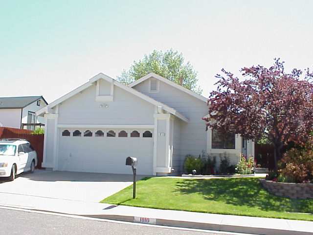 1810 Amarak Way Reno, NV 89523 - Photo 1 of 1 a front view of a house with a yard and garage