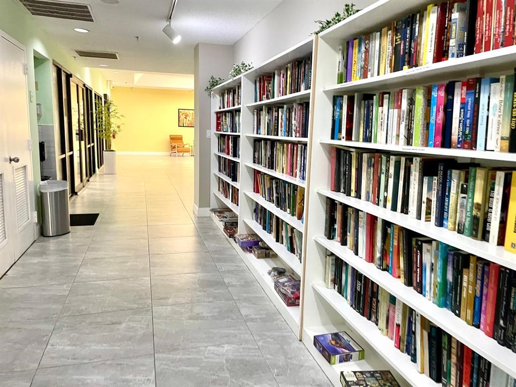 10444 Northwest 30th Court, Unit 409 Sunrise, FL 33322 - Photo 22 of 28 a view of an empty room with shelves