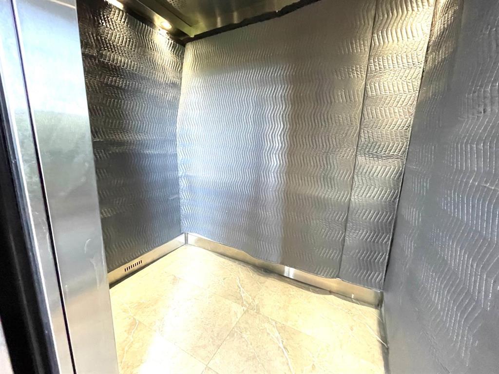 10444 Northwest 30th Court, Unit 409 Sunrise, FL 33322 - Photo 24 of 28 a view of a big room with wooden floor