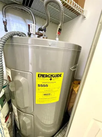 a dining room with furniture and large windows