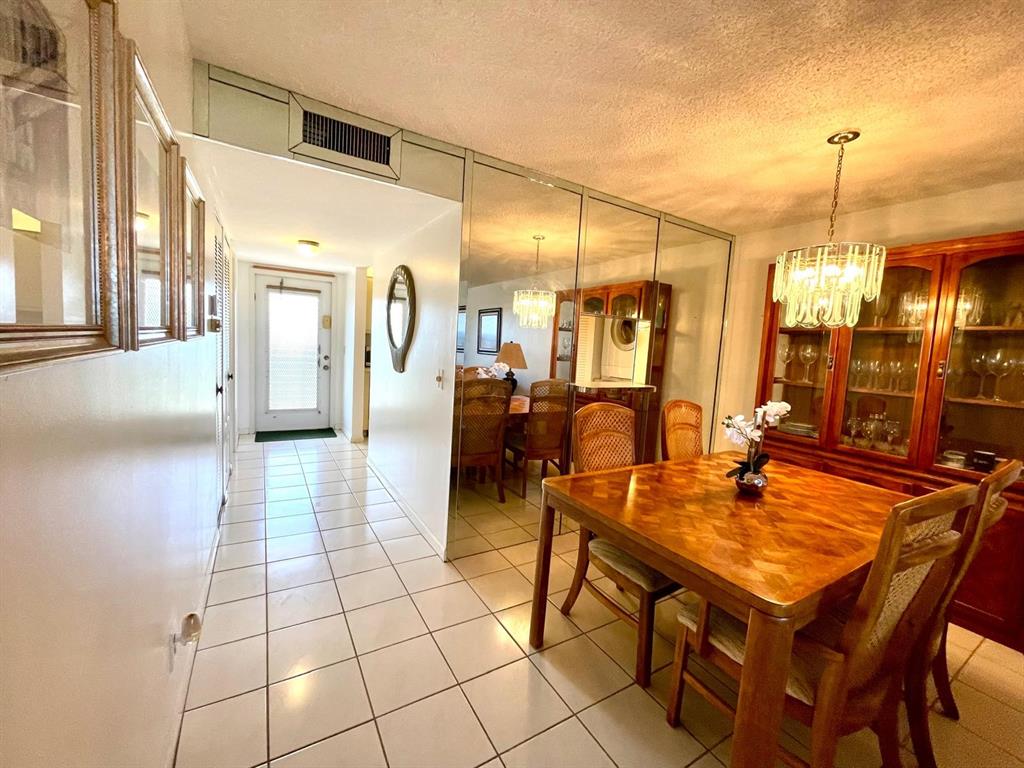 10444 Northwest 30th Court, Unit 409 Sunrise, FL 33322 - Photo 9 of 28 a very nice looking dining room with a table and chairs