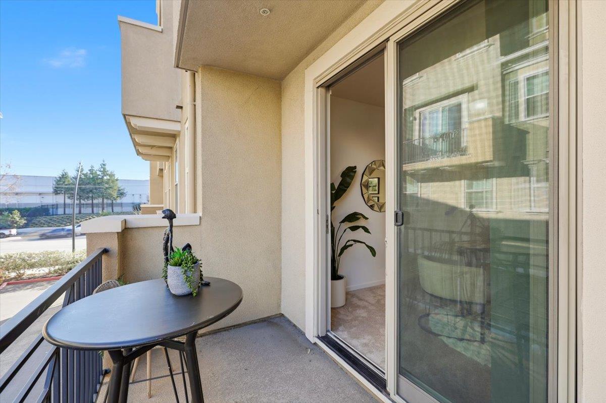1989 Trento Loop Milpitas, CA 95035 - Photo 11 of 32 a view of a balcony dining table and chairs