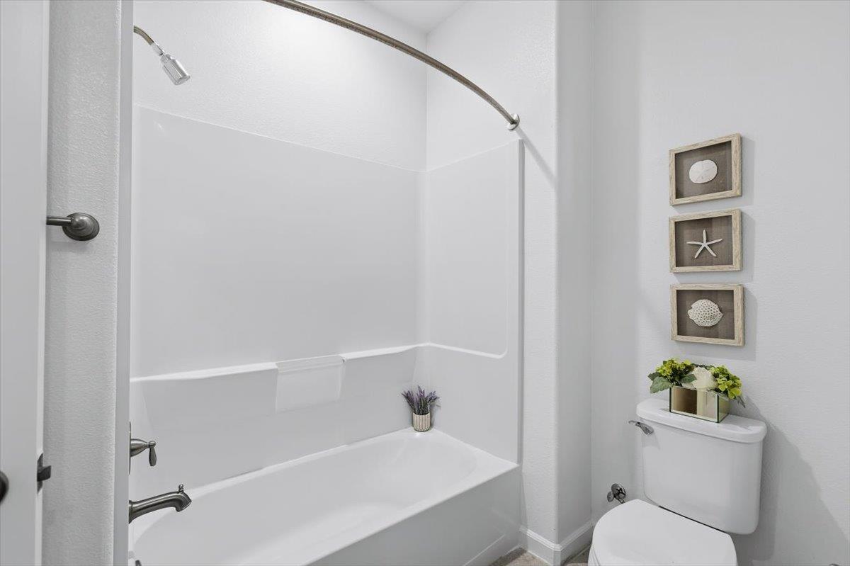 1989 Trento Loop Milpitas, CA 95035 - Photo 15 of 32 a bath room with a toilet and a bath tub