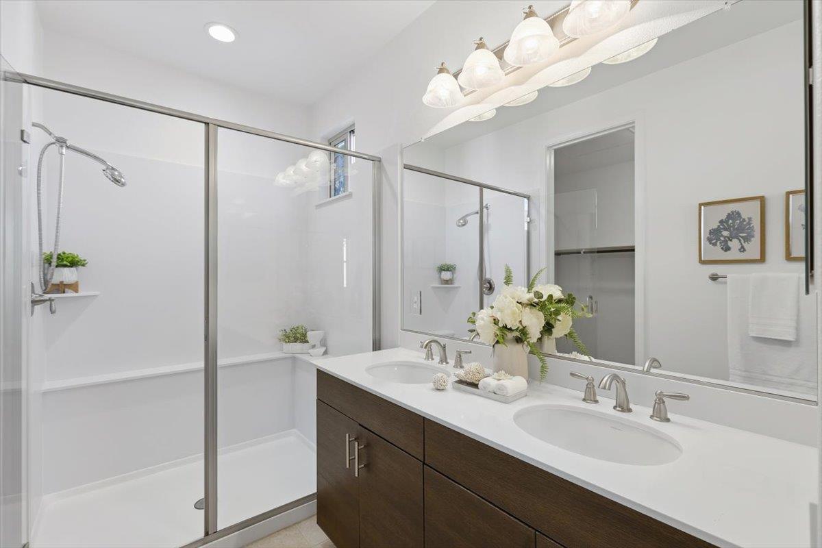 1989 Trento Loop Milpitas, CA 95035 - Photo 20 of 32 a bathroom with a double vanity sink mirror and shower