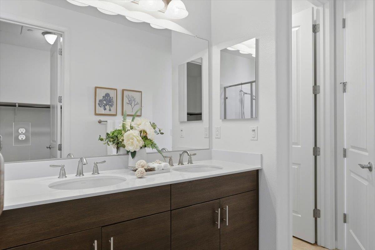 1989 Trento Loop Milpitas, CA 95035 - Photo 21 of 32 a bathroom with a sink vanity and a mirror