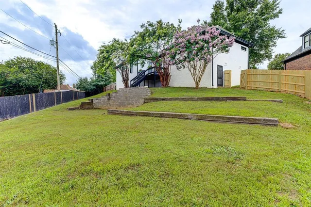 a view of swimming pool with a yard