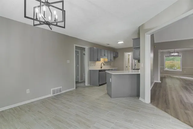 a view of kitchen with wooden floor