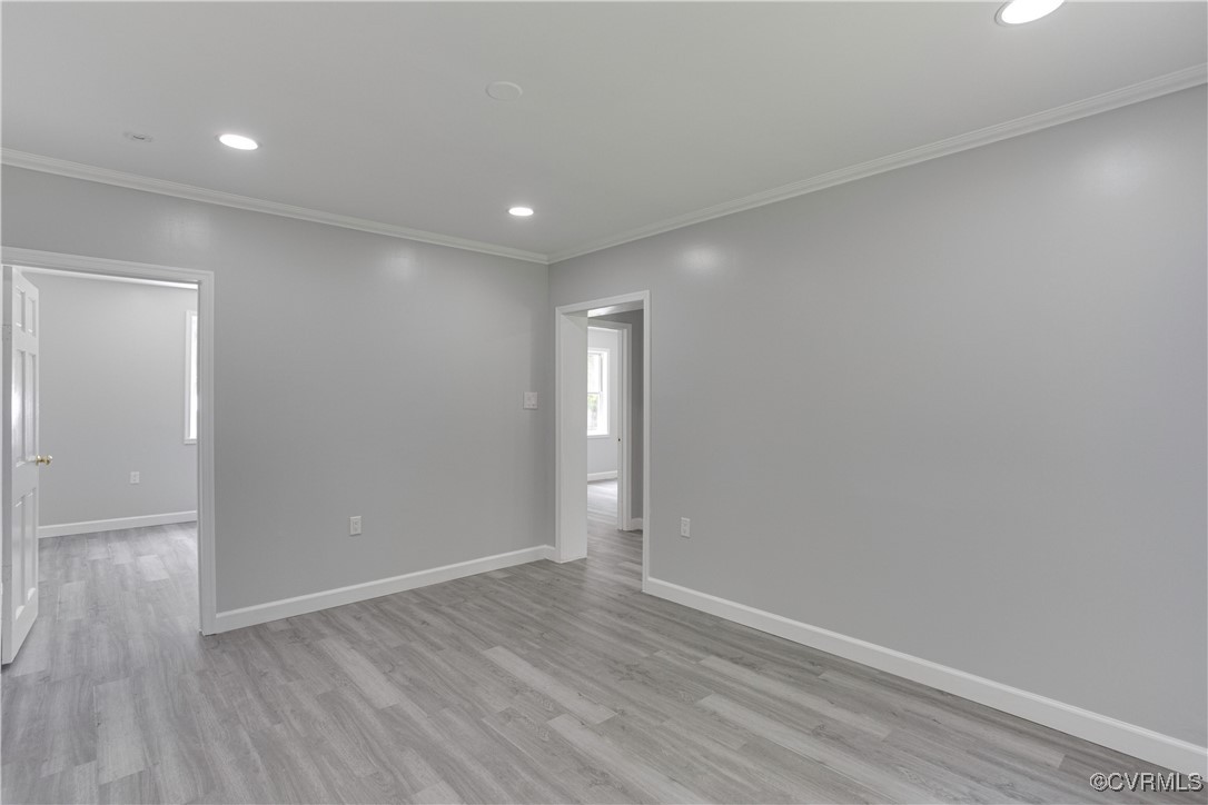 17072 Gun Barrel Road Montpelier, VA 23192 - Photo 15 of 43 Empty room featuring crown molding, light wood-typ