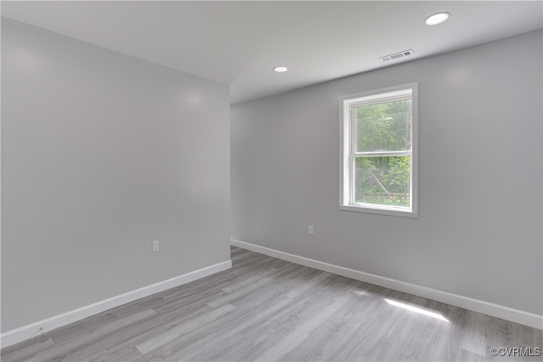 17072 Gun Barrel Road Montpelier, VA 23192 - Photo 21 of 43 Empty room with light wood finished floors, basebo