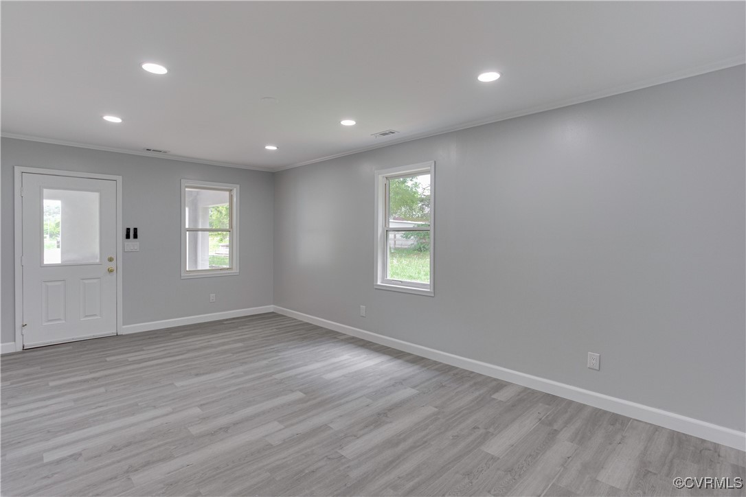 17072 Gun Barrel Road Montpelier, VA 23192 - Photo 8 of 43 Spare room featuring crown molding, baseboards, li